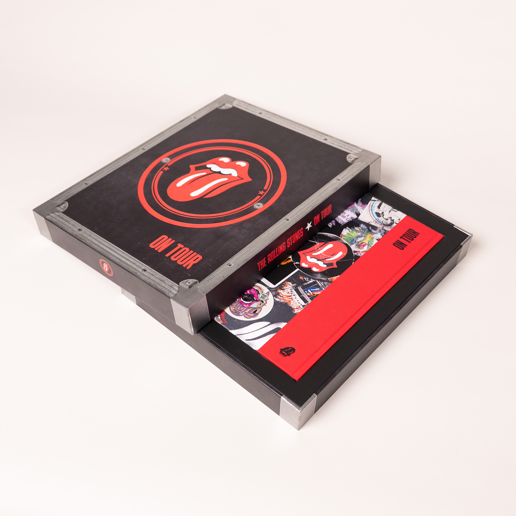 The case of the deluxe The Rolling Stones: On Tour is opened to reveal the hardback book, prints and ephemera included.
